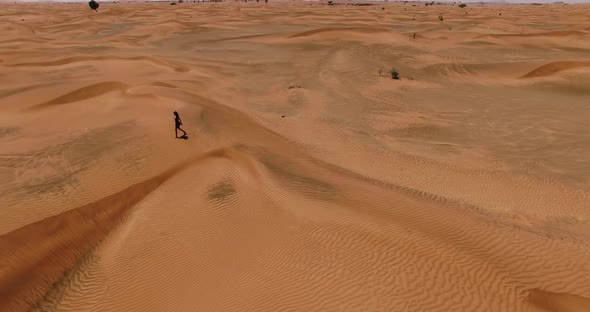 Young Jady Walk in the Desert