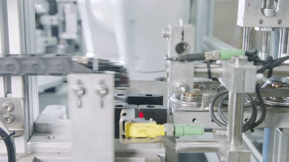 Advanced robotic machine manufacturing parts in an automated assembly line alt