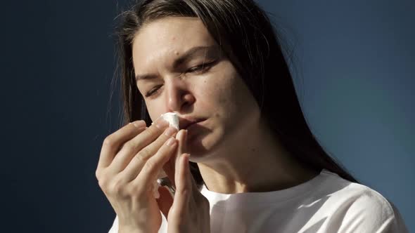 Portrait of a Sick Woman with Symptoms of Flu Cold or Coronavirus