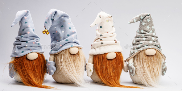 WEB banner. Bearded cute gnomes in caps on a light background. Handmade soft toy. Copy space
