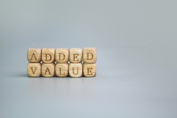 wooden cube with the word Added Value. - Stock Photo - Images