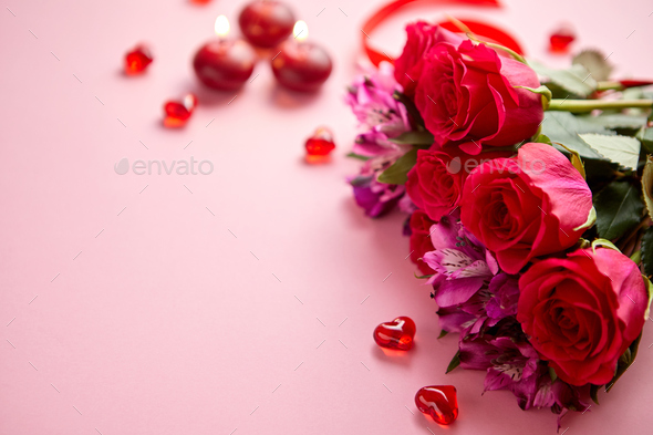 Mixed flowers bouquet with roses, candles and heart shaped acrylic decorations - Stock Photo - Images
