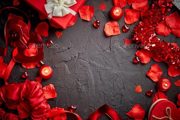 Red roses petals, candles, dating accessories, boxed gifts, hearts, sequins - Stock Photo - Images