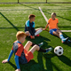 Teenage boys football team talking on soccer field - PhotoDune Item for Sale
