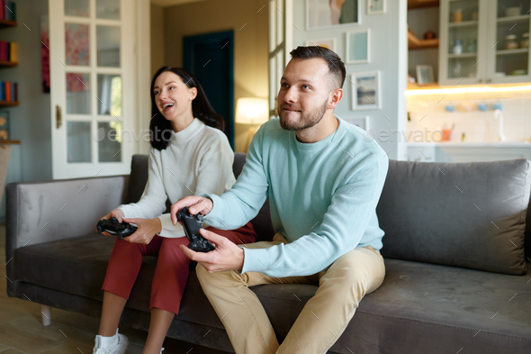 Overjoyed family playing video games - Stock Photo - Images