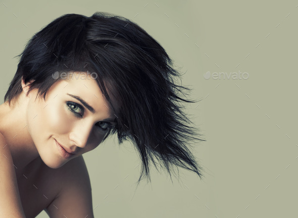 That alternative funky look. A funky young woman with an alternative  hairstyle posing in studio. Stock Photo by YuriArcursPeopleimages