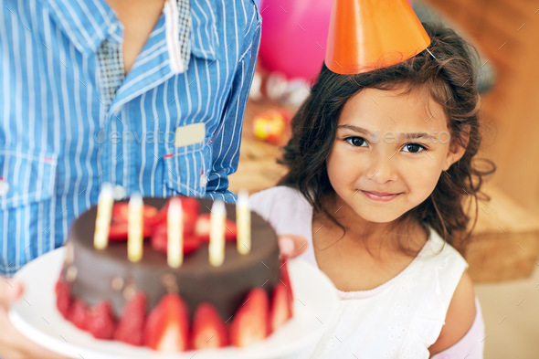Free Photos - A Young Girl Is Celebrating Her Birthday With A Cake Adorned  With A Single Candle. She Is Happily Posing While Holding The Cake, Wearing  A Bow And Smiling Brightly,