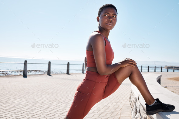 Stretching, legs and black woman on the promenade for fitness start, cardio motivation and exercise