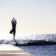 Hes one with the sea. Full-length concept shot of a young man standing on a  wave. Stock Photo by YuriArcursPeopleimages