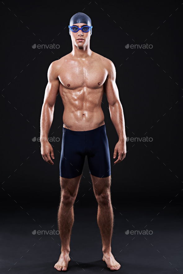 Sexy swimmer. Full length studio portrait of a young male swimmer.