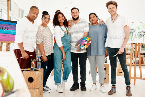 Full length shot of a diverse group of artists standing together during an art class in the studio