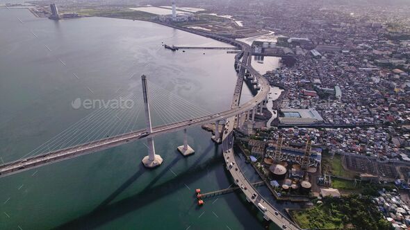 Aerial view of seaside Cebu cityscape and Cebu-Cordova bridge in the Philippines - Stock Photo - Images