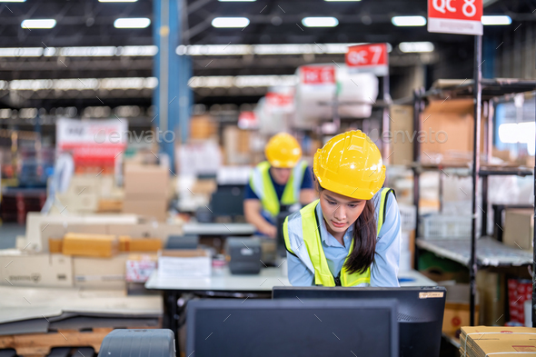 Worker working in the large depot storage warehouse concentrate check stock at cashier counter