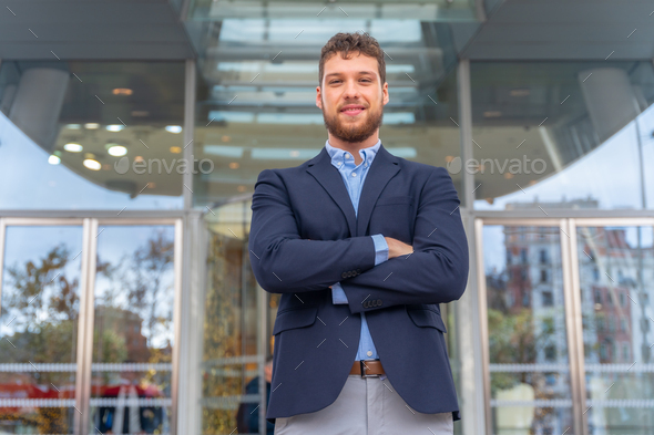 Portrait businessman CEO of a company at glass office entrance, finance ...