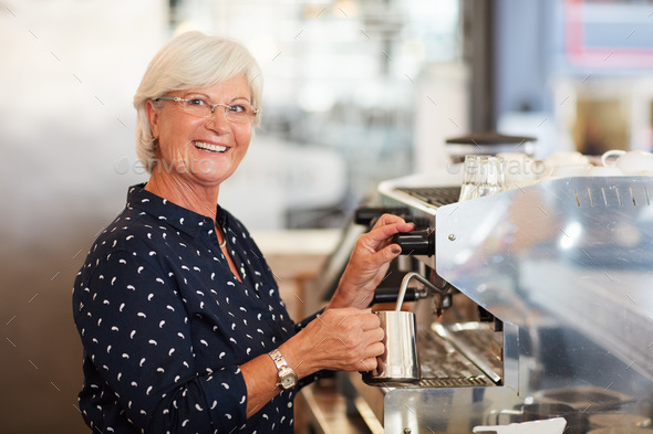 Youre never too old to dream new dreams. Portrait of a senior woman working in a coffee shop.