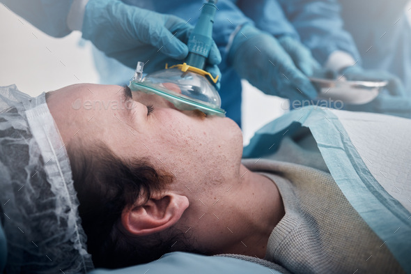 Anesthesia, mask and medical with man in surgery for ventilation and operation. Photo by YuriArcursPeopleimages