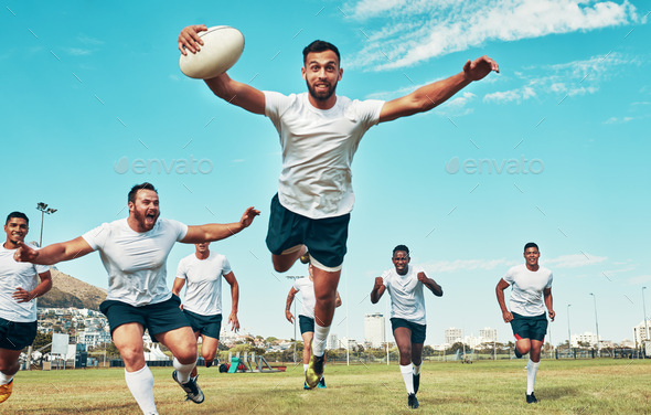 Shot of a rugby player scoring a try while playing on a field