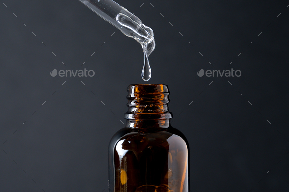 Pipette with transparent serum - Stock Photo - Images