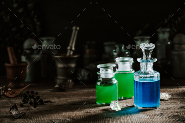 Witchcraft still life concept with potion, herbs ingredients and magical equipment