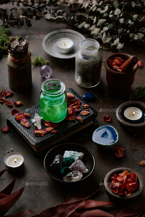 Witchcraft still life concept potion spell book, herbs ingredients candles and magical equipment