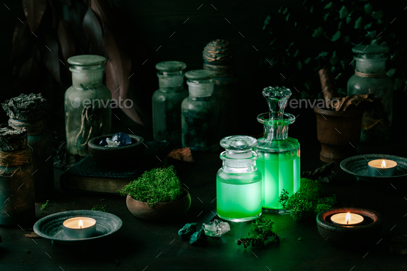 Witchcraft still life concept with potion, spell book, herbs ingredients candles magical equipment