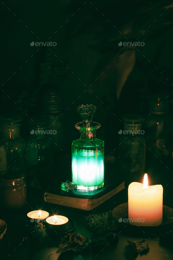 Witchcraft still life concept with potion, spell book, herbs ingredients candles magical equipment