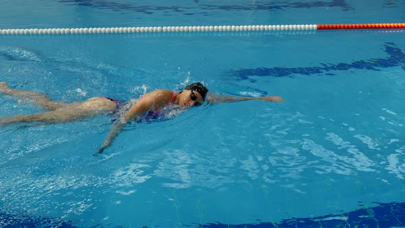 Woman Professional Swimmer Practicing Freestyle