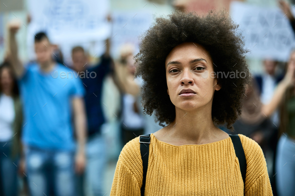 Portrait of young African American woman on a protest for black civil rights.
