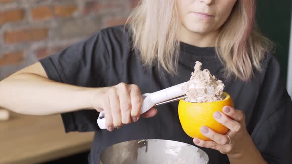 Professional Cook Puts Handmade Icecream Into Orange Peels
