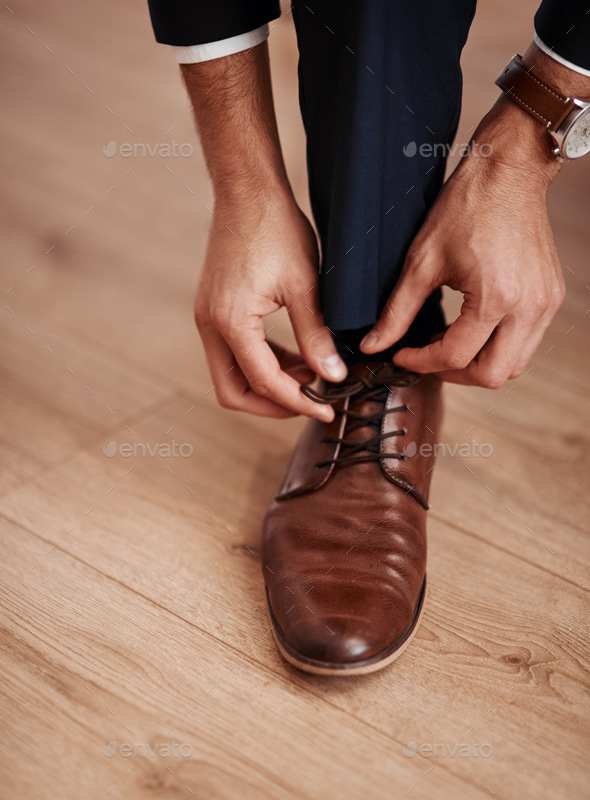 Im ready for the next step in my life. Cropped shot of an unrecognizable man putting on his shoes.