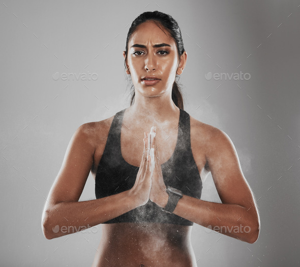 Cropped shot of a beautiful young woman dusting her hands with talc powder