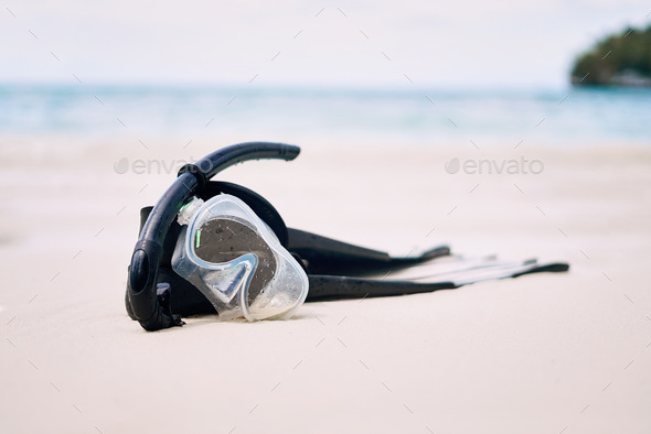 Its time to go down under. Still life shot of snorkeling gear on a beach in Raja Ampat, Indonesia.