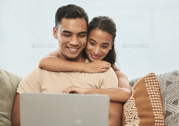 The best thing to hold onto in life. Shot of a couple using a laptop at home.