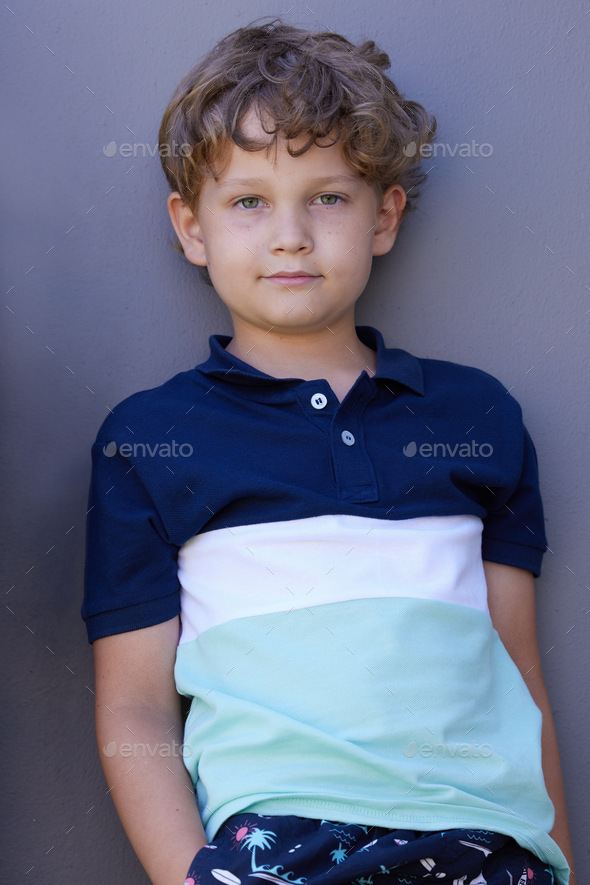 Hes a real charmer Portrait of an adorable little boy leaning against