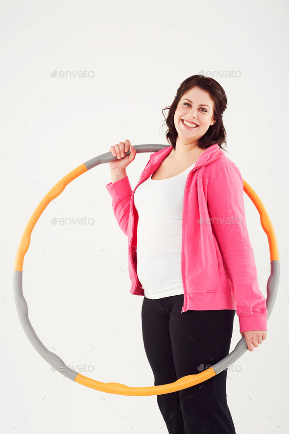 Its not a diet, its a lifestyle change. Cropped view of a smiling woman holding a plastic hoop.