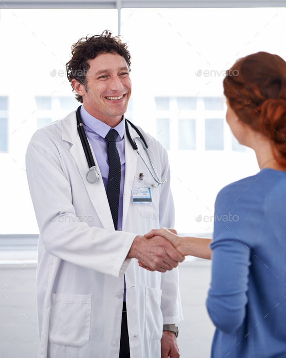 He has a good bedside manner. Cropped shot of a doctor and shaking his patients hand.