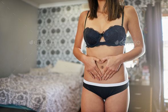 Young woman with her hand in panties. Stock Photo by