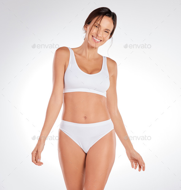 Shot Of An Attractive Young Woman Standing Alone In The Studio And Posing  In Her Underwear Stock Photo - Download Image Now - iStock