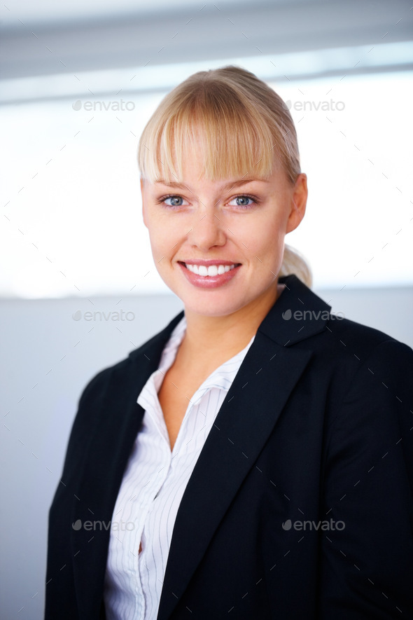 A Happy business woman, smile and standing in confidence for