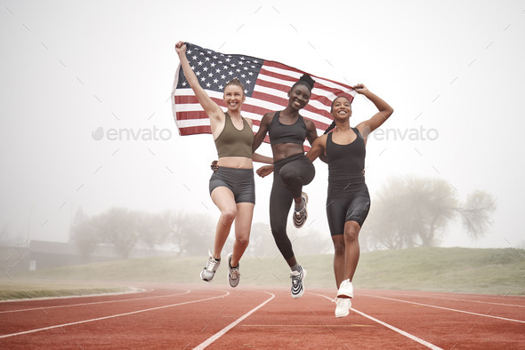 Remember to uplift your team members. Shot of a young sports team holding the american flag.