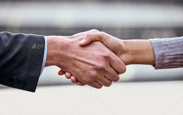 Its a done deal. Shot of a group of unrecognizable businesspeople shaking hands.