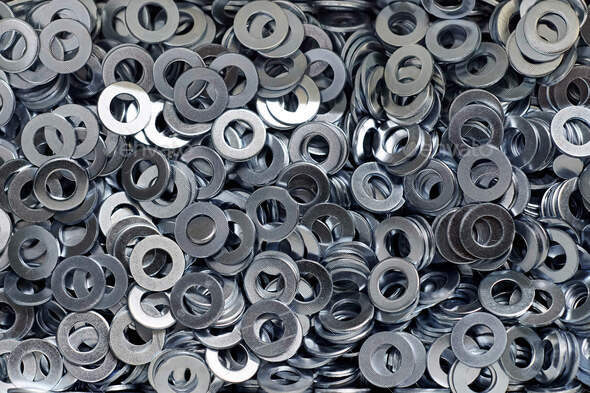 Bunch of stainless steel galvanized flat washers for fastener screws, nuts or bolts