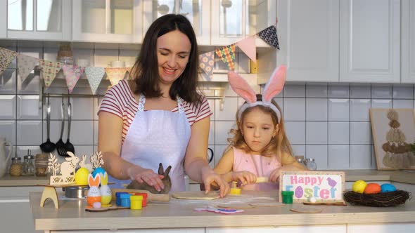 Family Making Cookies with Cute Easter Bunny alt