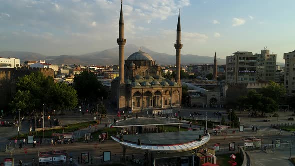 Crowded City Square With Mosque alt