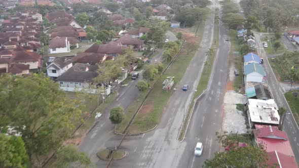 Aerial view of blue car moving on the empty road in Desa Pinggiran Putra, Kajang