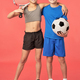 Adorable sporty kids standing against red background - PhotoDune Item for Sale