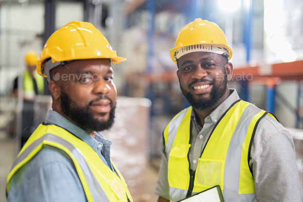 African american working in warehouse check forklift truck loading ...