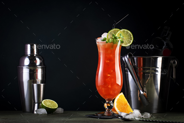 Hurricane, classic alcoholic cocktail with dark and white rum, ice, syrup, grenadine