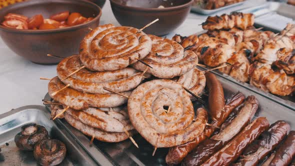 Ready-to-Eat Grilled Meat in a Street Food Shop Window. Ready-made Food on Party
