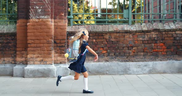 Side View of Pretty Little Girl Running To Her Beautiful Mother After Lessons alt